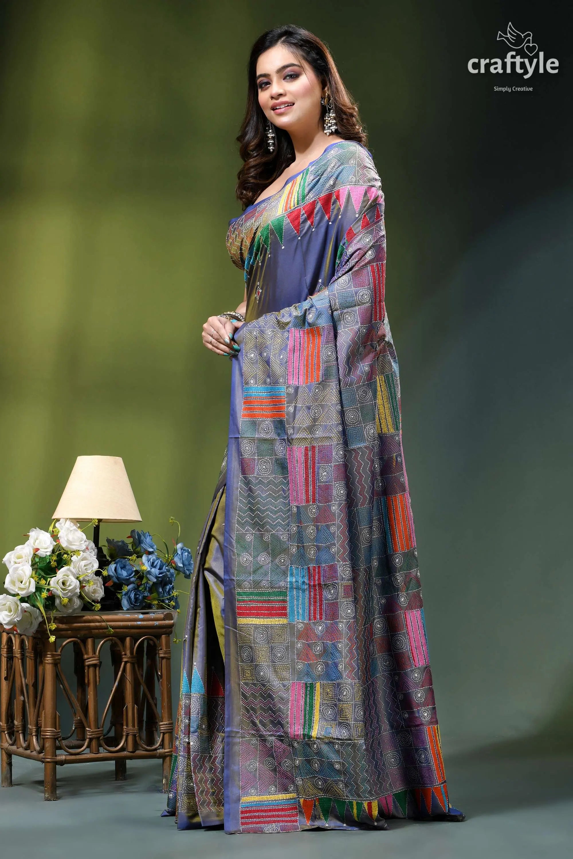 Handcrafted geometric design silk kantha work saree in cool grey woman wears vibrant multi-colored saree 3