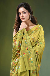 Handcrafted leaf green silk kantha saree with heron and lotus motif woman wears vibrant olive 2