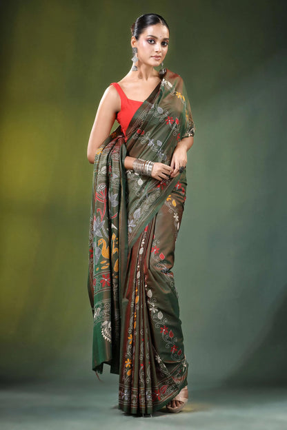 Handcrafted olive green nature theme silk kantha saree woman wears 5