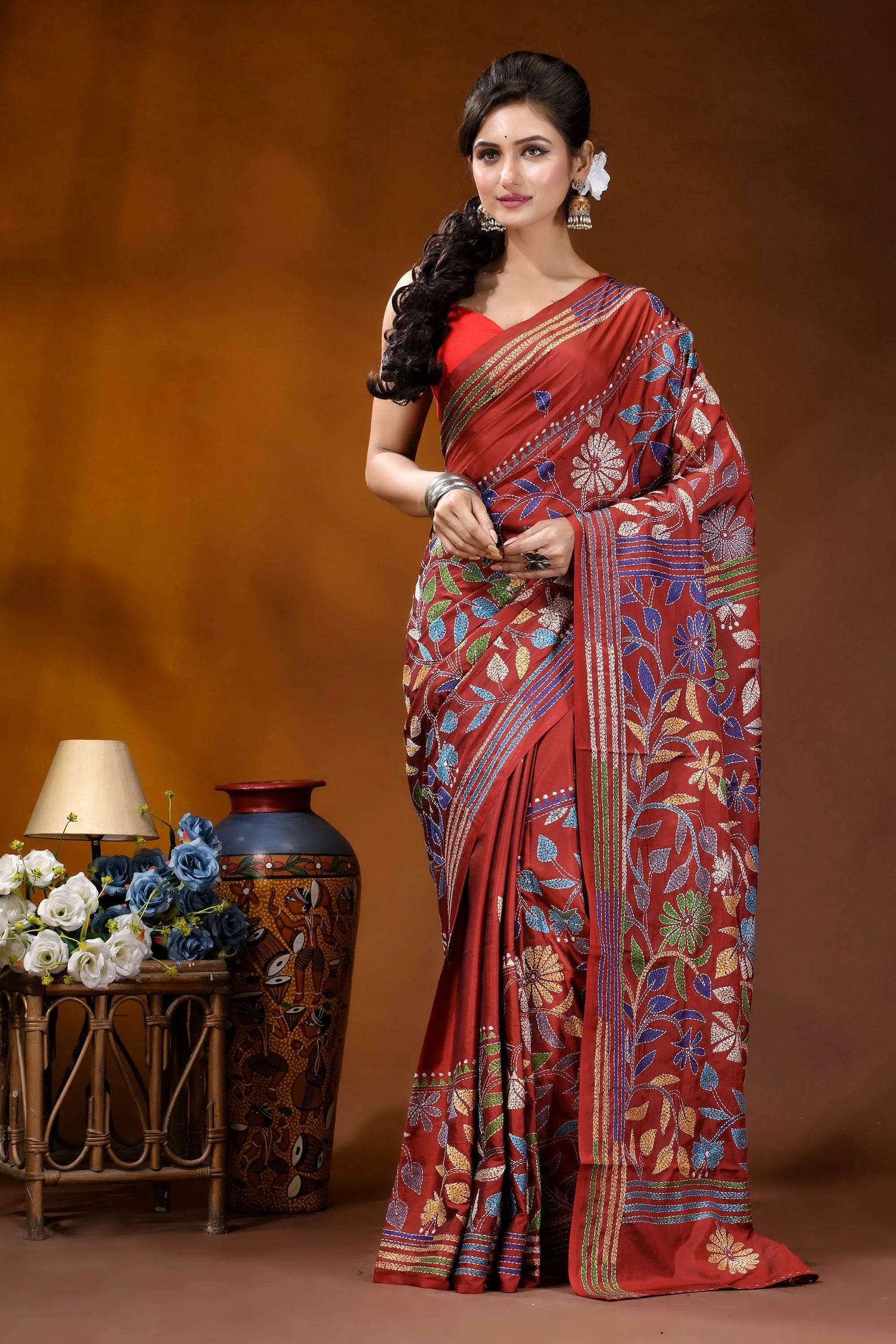 Handcrafted pale carmine silk kantha saree in multicolor floral motif woman wears rich red silk 2