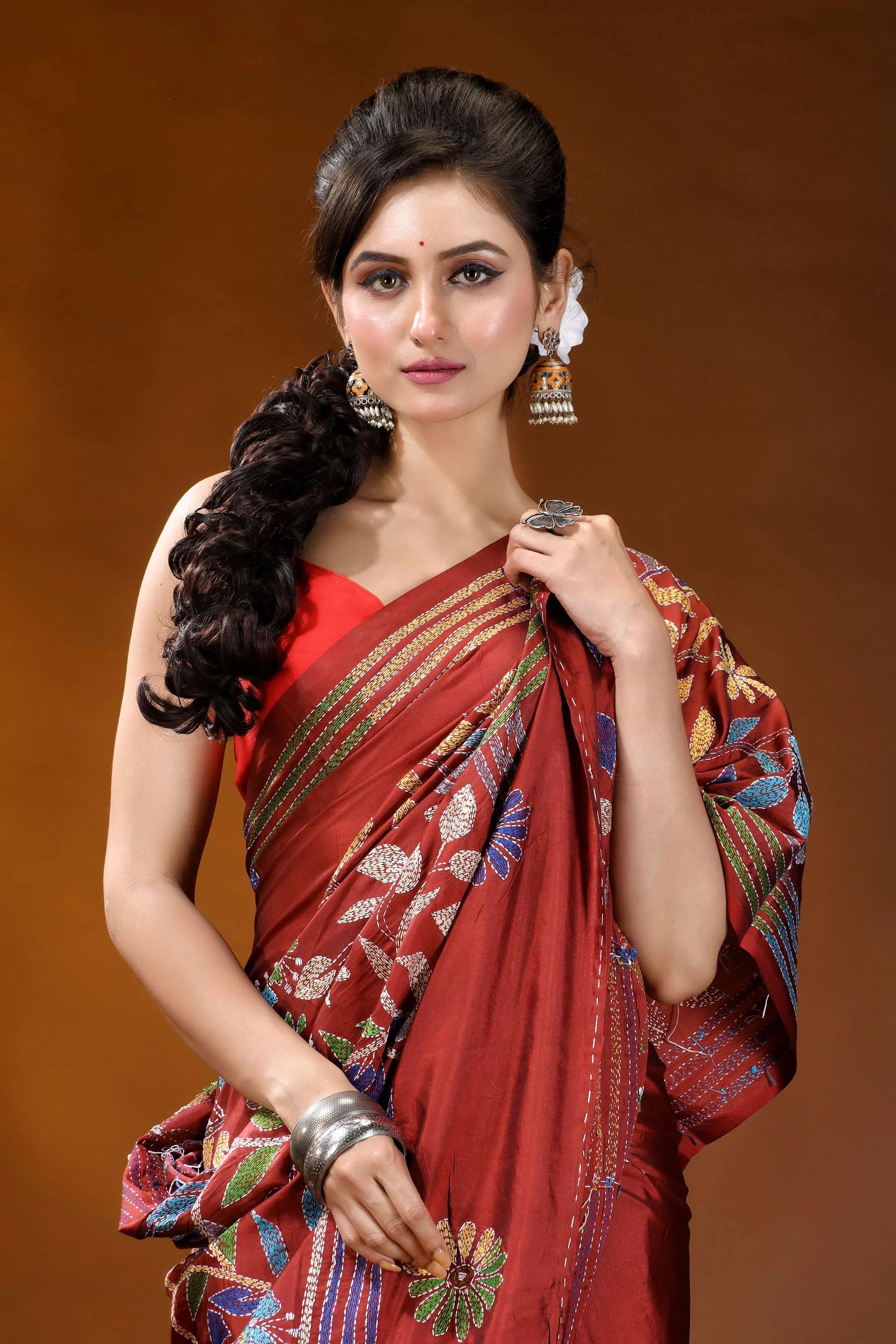 Handcrafted pale carmine silk kantha saree in multicolor floral motif woman wears vibrant red silk 5