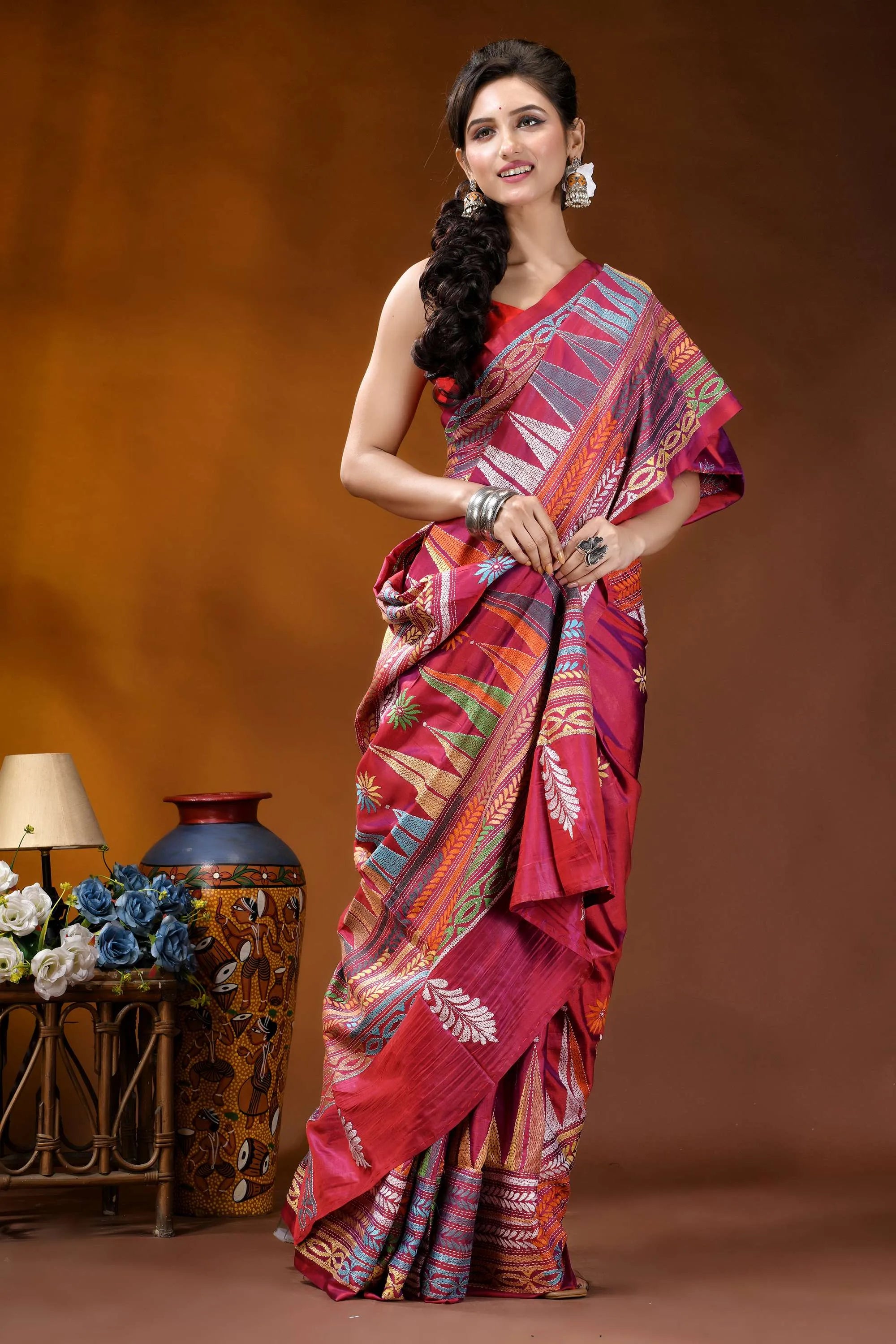 Handcrafted rich maroon geometric design kantha stitch silk saree woman wears vibrant red multicolored 4
