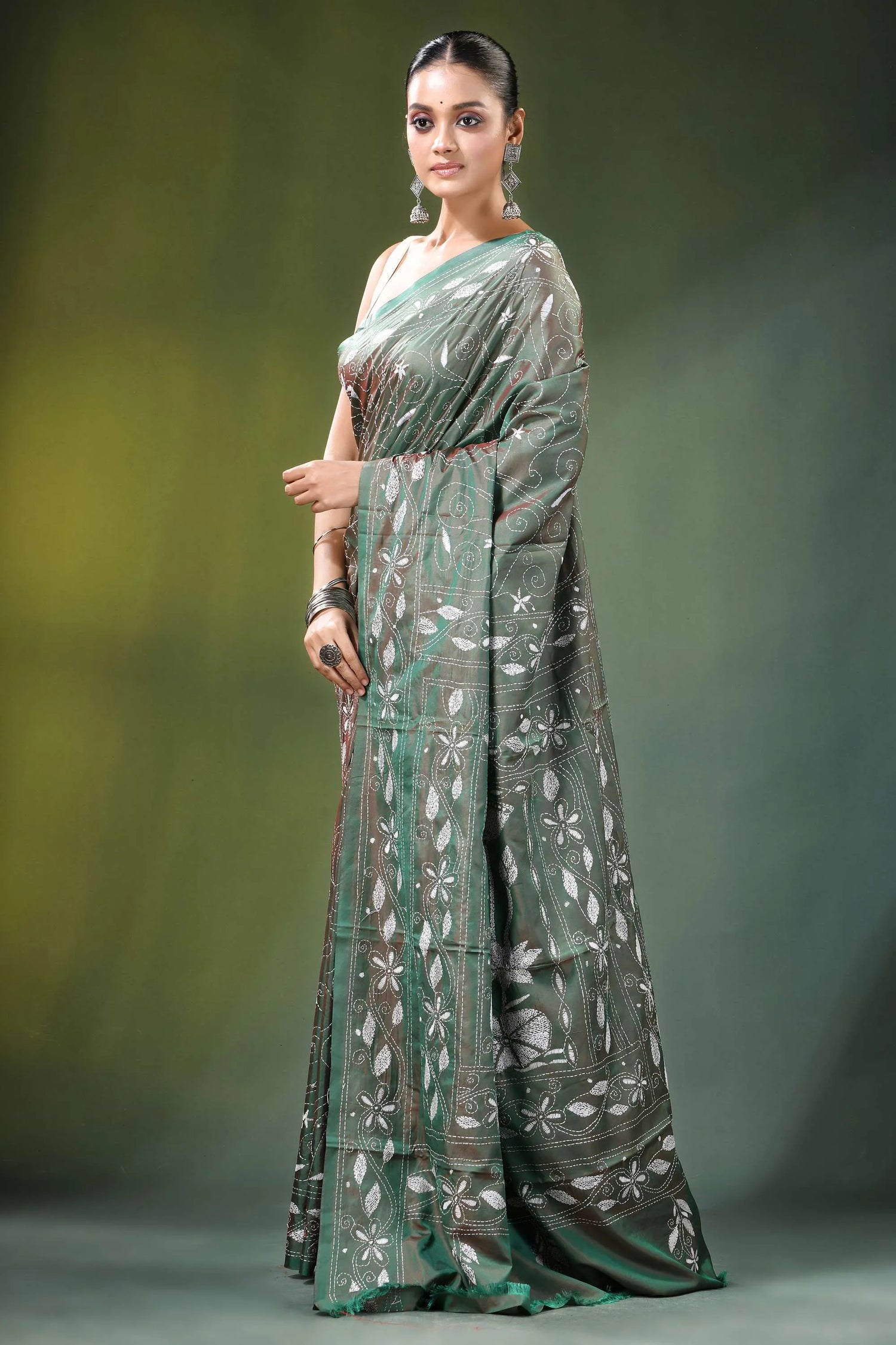 Handcrafted sage green nature theme silk kantha saree woman wears dark 3