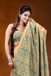 Handmade beige geometric design kutch embroidery silk saree woman wears beige saree intricate 2