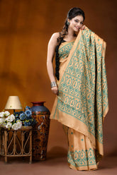 Handmade beige geometric design kutch embroidery silk saree woman wears beige teal patterned 6