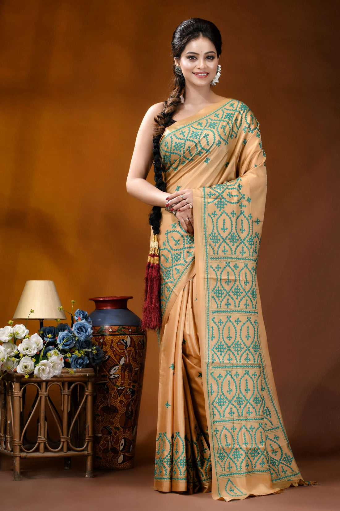 Handmade beige geometric design kutch embroidery silk saree woman wears beige silk saree 1