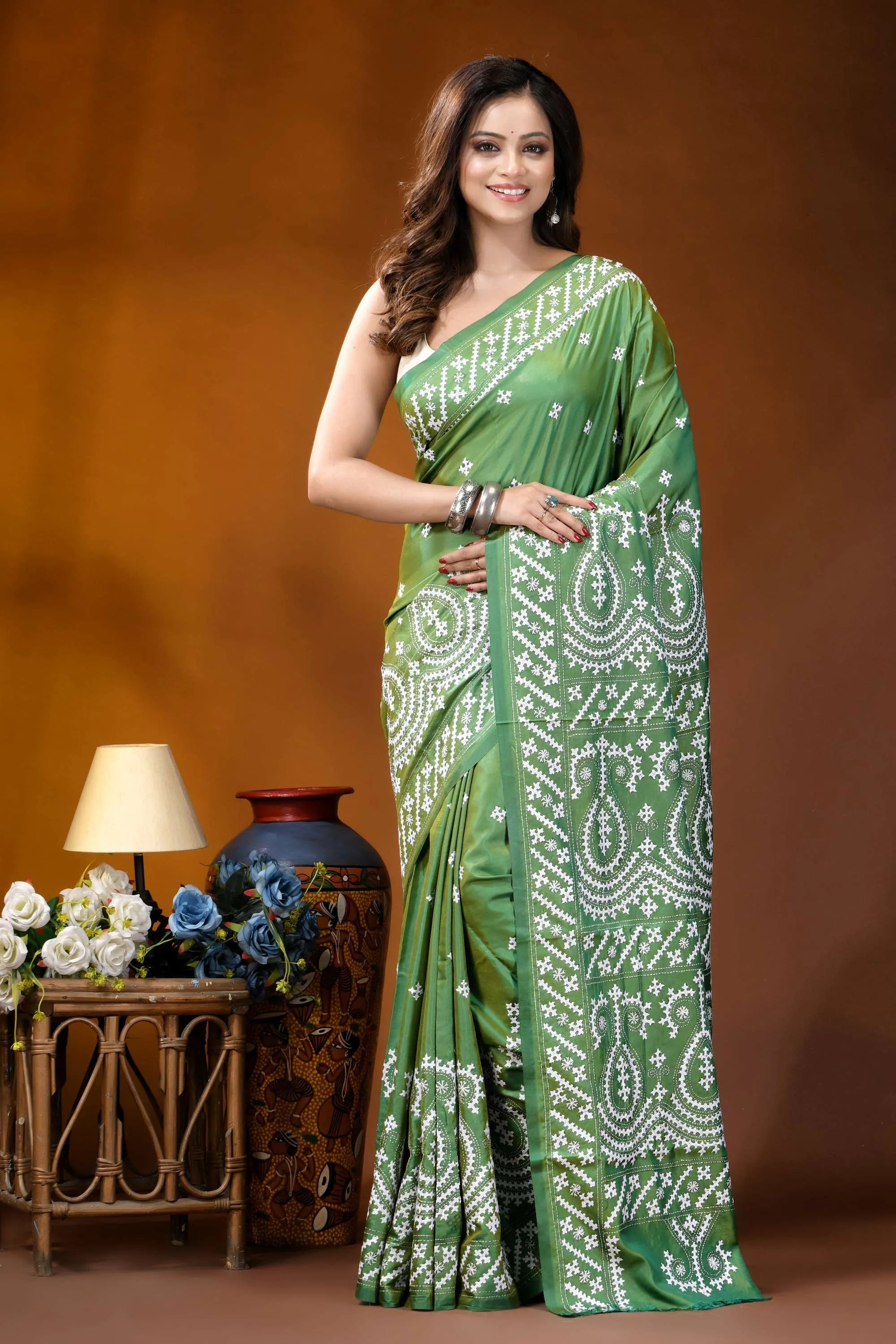 Handmade emerald green paisley design kutch work silk saree woman wears vibrant green saree 1