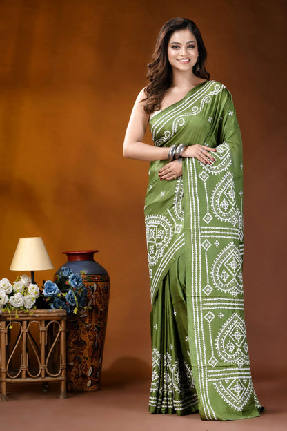 Leaf green ethnic motif hand embroidered gujrati stitch silk saree woman wears vibrant olive green 1