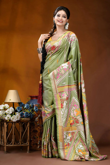 Leaf green floral design handcrafted kantha embroidery silk saree woman wears vibrant olive green 4