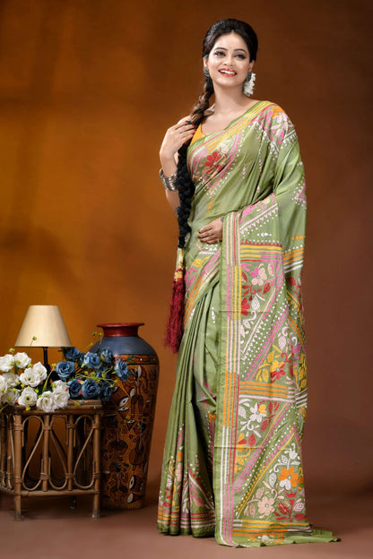 Leaf green floral design handcrafted kantha embroidery silk saree woman wears vibrant olive green 6