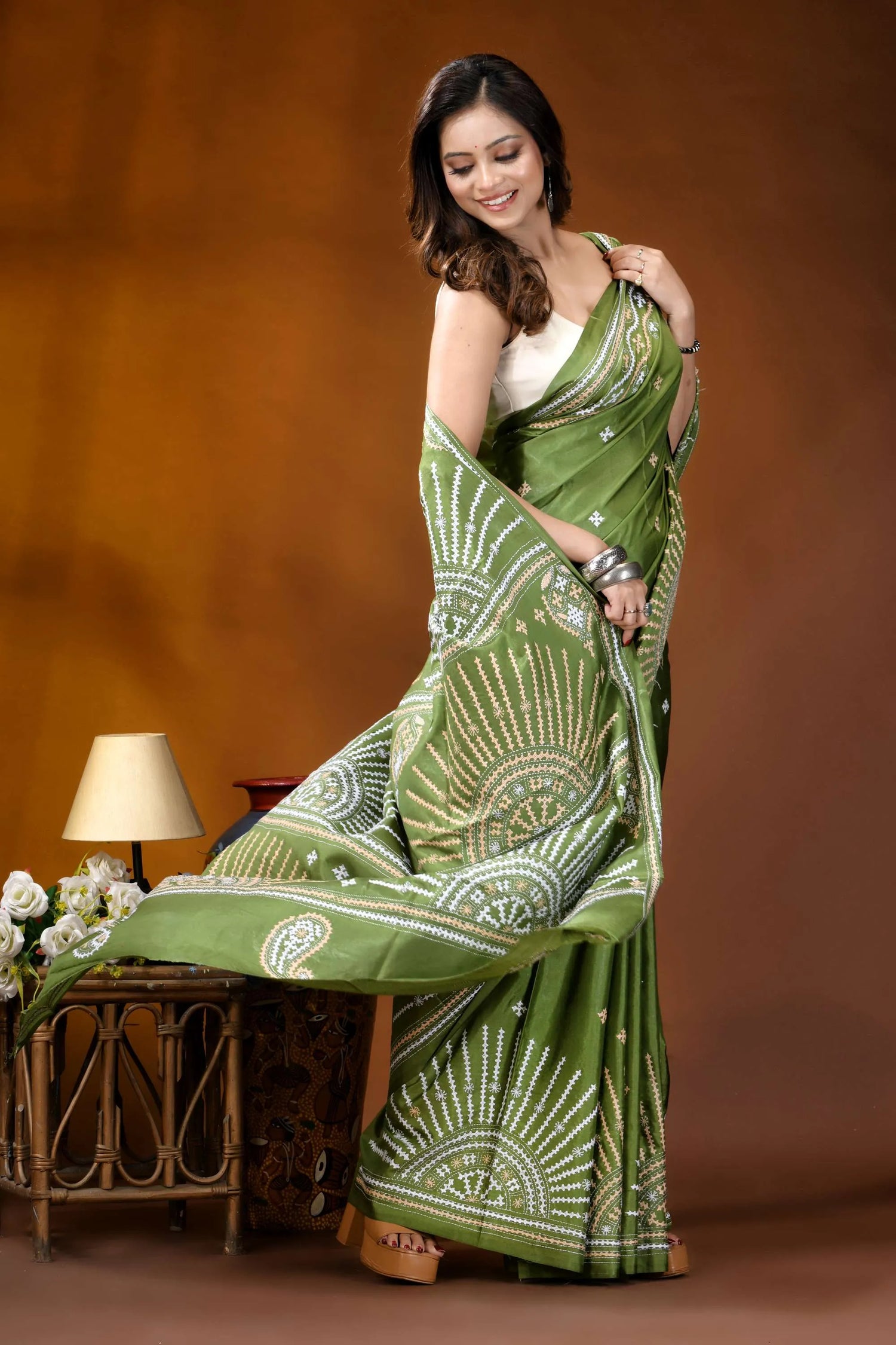 Leaf green multicolor design handmade kutch embroidery silk saree woman wears vibrant green saree 4