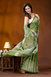 Leaf green multicolor design handmade kutch embroidery silk saree woman wears vibrant green saree 4