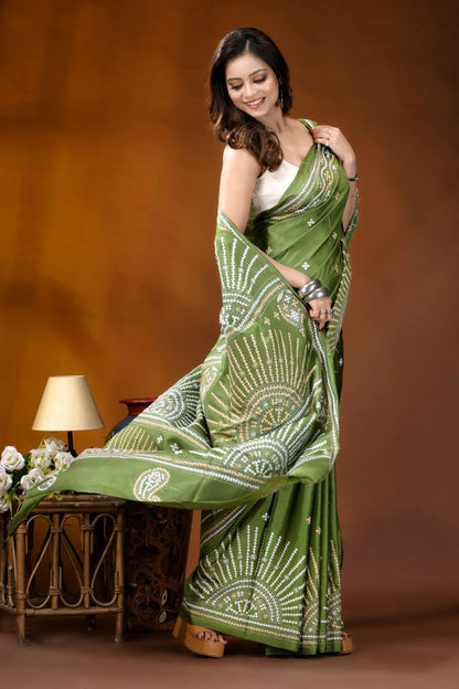 Leaf green multicolor design handmade kutch embroidery silk saree woman wears vibrant green saree 4