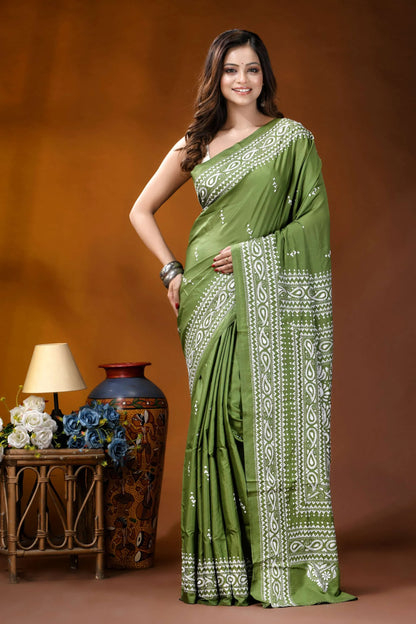 Leaf green paisley design hand embroidery silk kantha stitch saree woman wears vibrant olive green 1