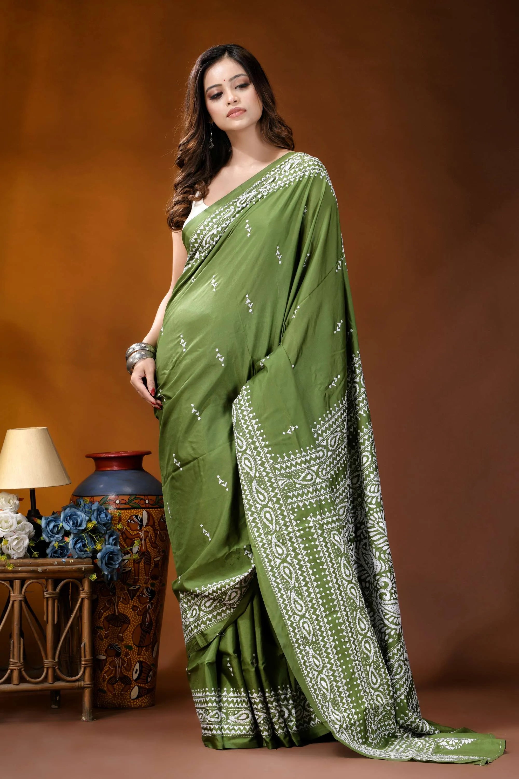 Leaf green paisley design hand embroidery silk kantha stitch saree woman wears vibrant olive green 4