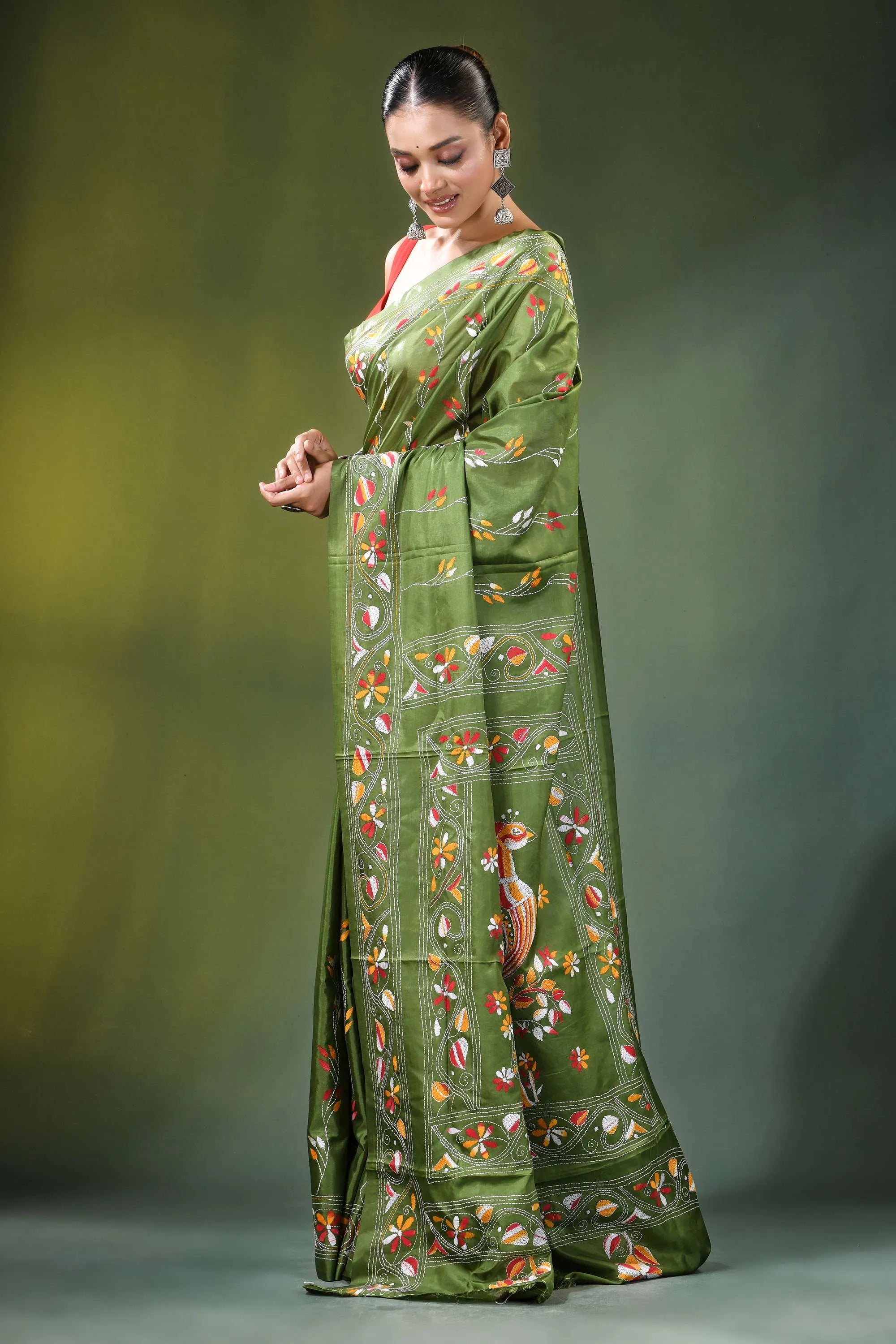 Leaf green peacock motif handmade silk kantha saree woman wears vibrant olive 3