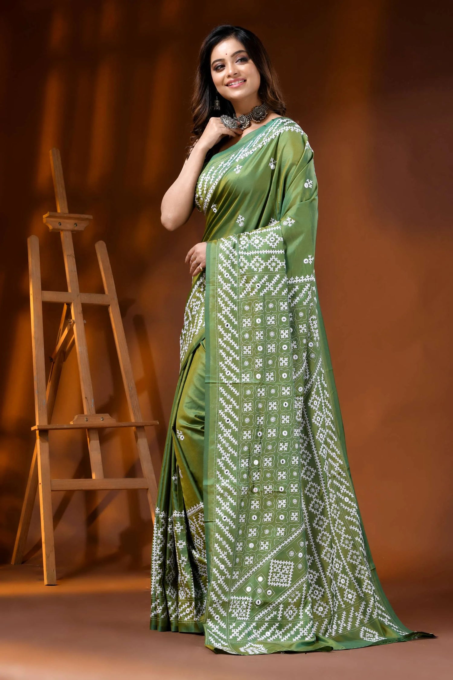 Leaf green silk kutch work saree with hand embroidered mirror detailing 3