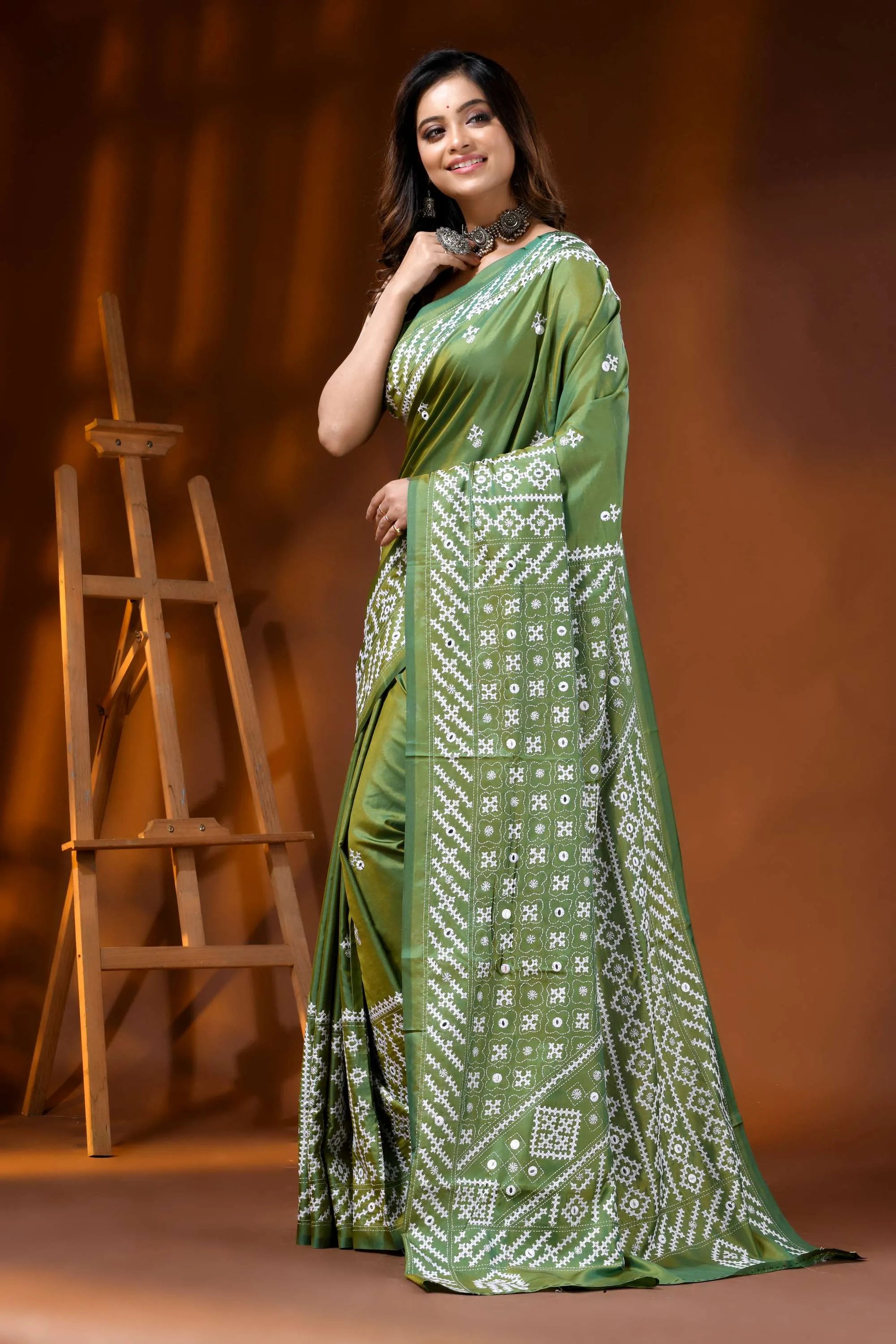 Leaf green silk kutch work saree with hand embroidered mirror detailing 3