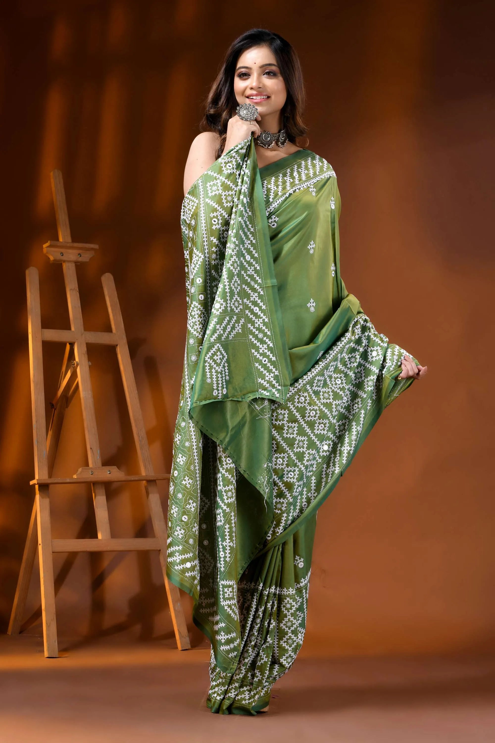 Leaf green silk kutch work saree with hand embroidered mirror detailing 4