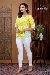 Lemon yellow cotton printed top with three quarter sleeves woman yellow patterned white leggings 3