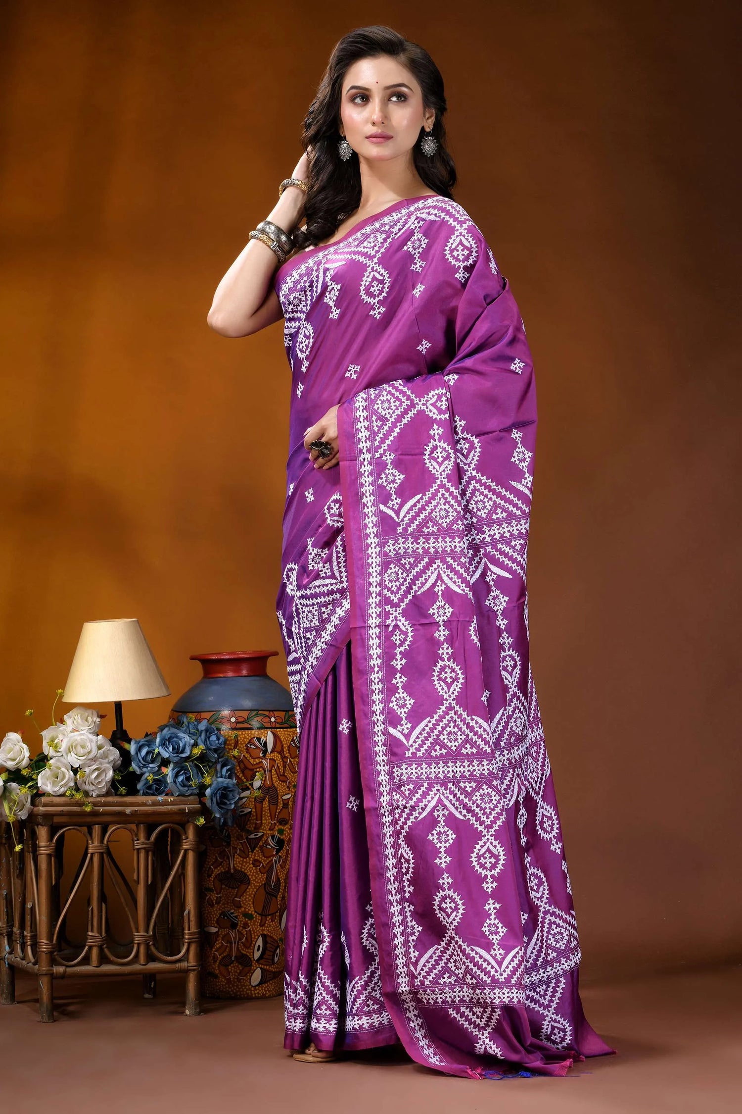 Magenta ethnic motif hand embroidery kutch silk saree woman wears vibrant purple saree 8