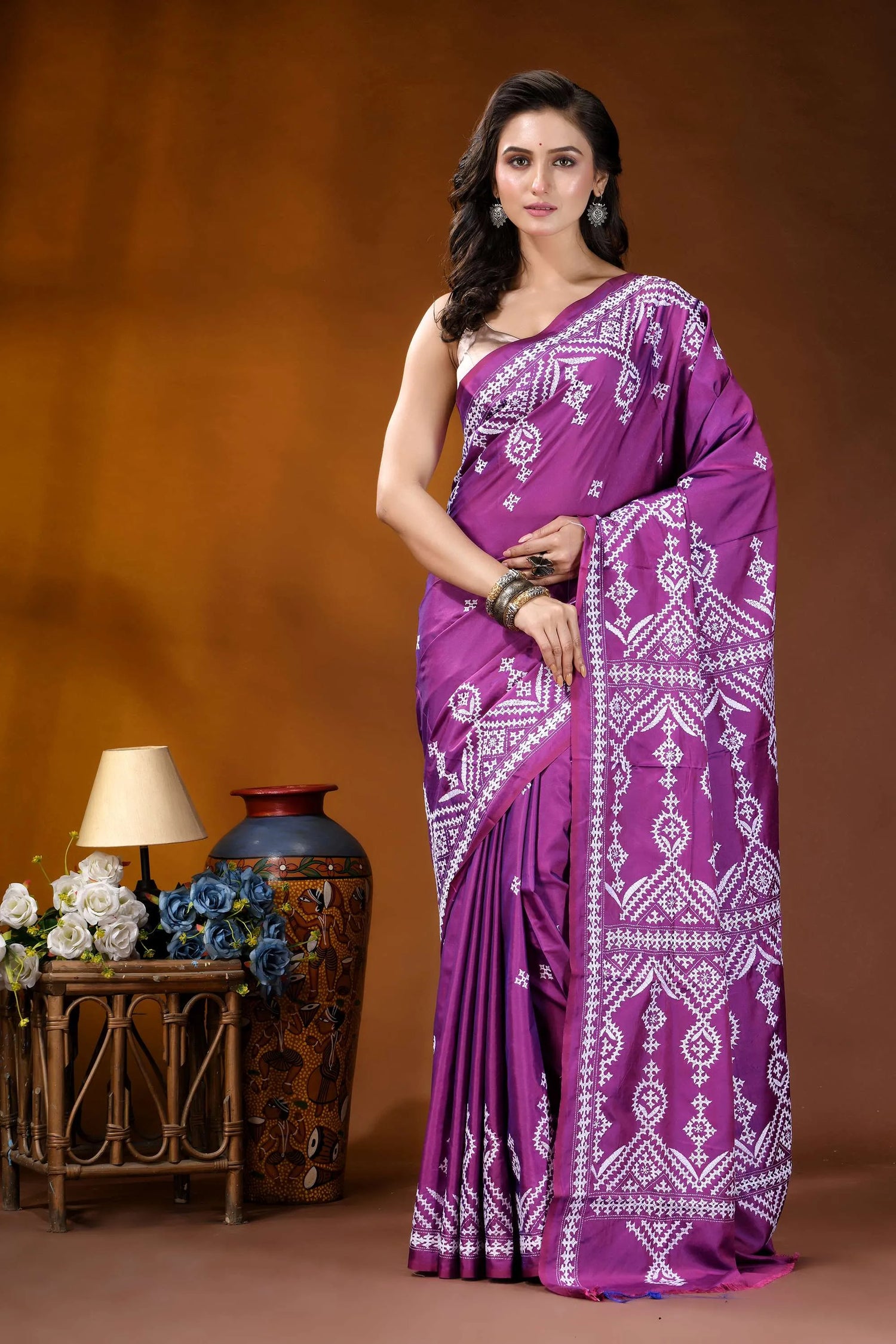 Magenta ethnic motif hand embroidery kutch silk saree woman wears vibrant purple saree 3