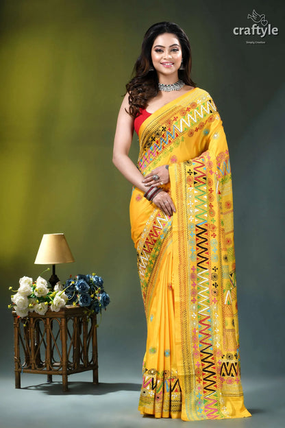 Marigold yellow hand embroidered floral design silk lambani saree vibrant yellow saree intricate multicolored 1