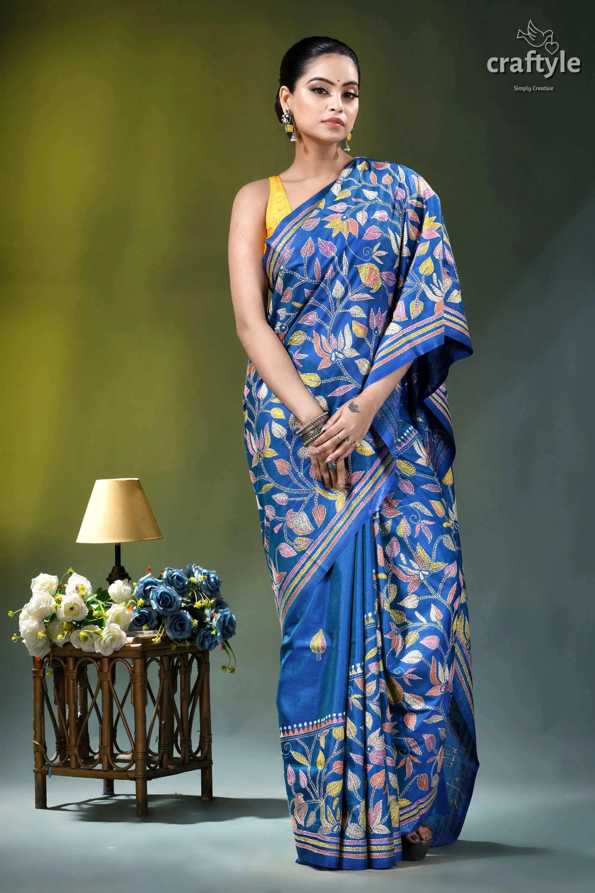 Medium blue multicolor lotus motif silk kantha stitch saree woman wears vibrant blue silk 4