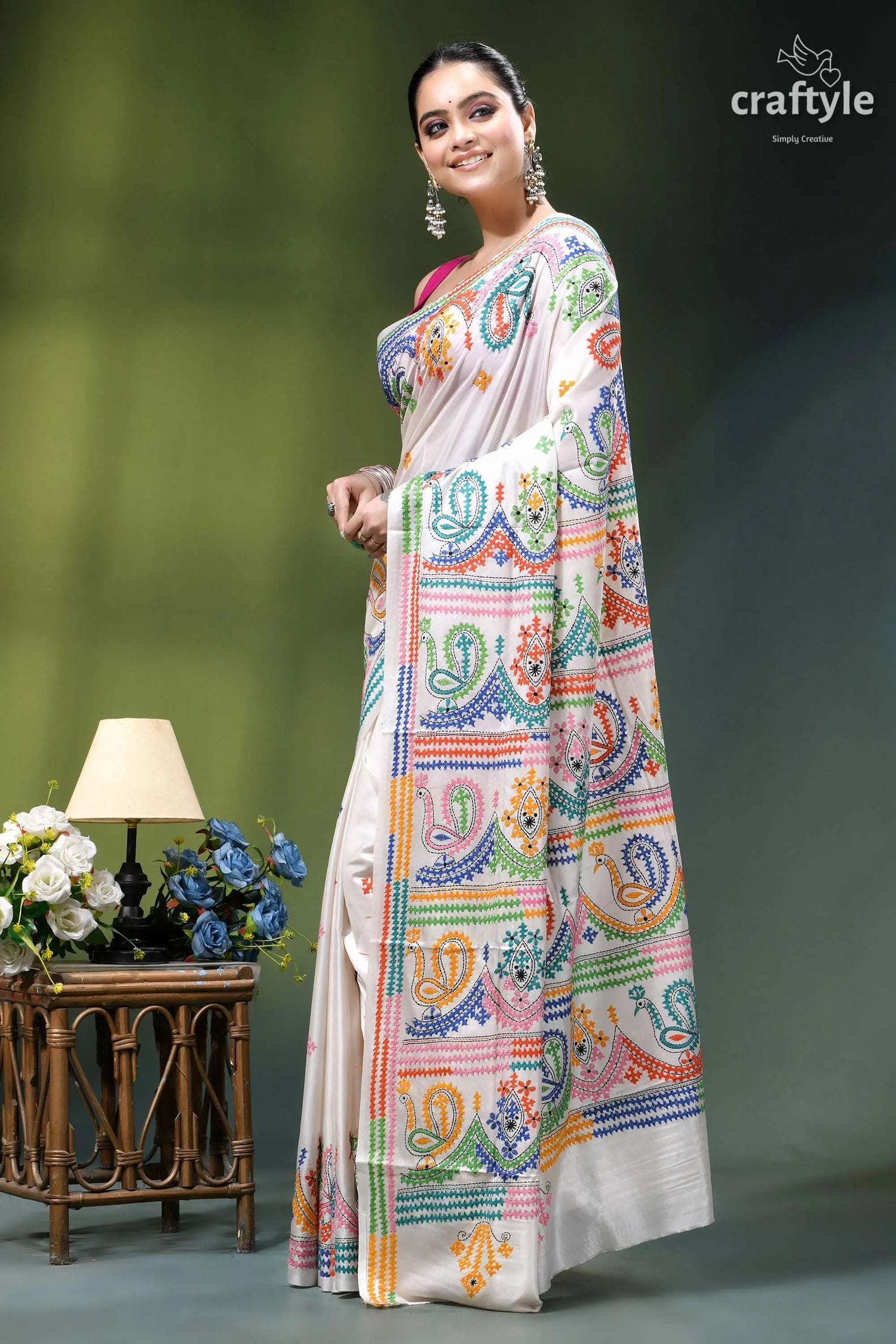 Milky white multithread kutch embroidery handmade silk saree woman wears cream-colored saree vibrant 3