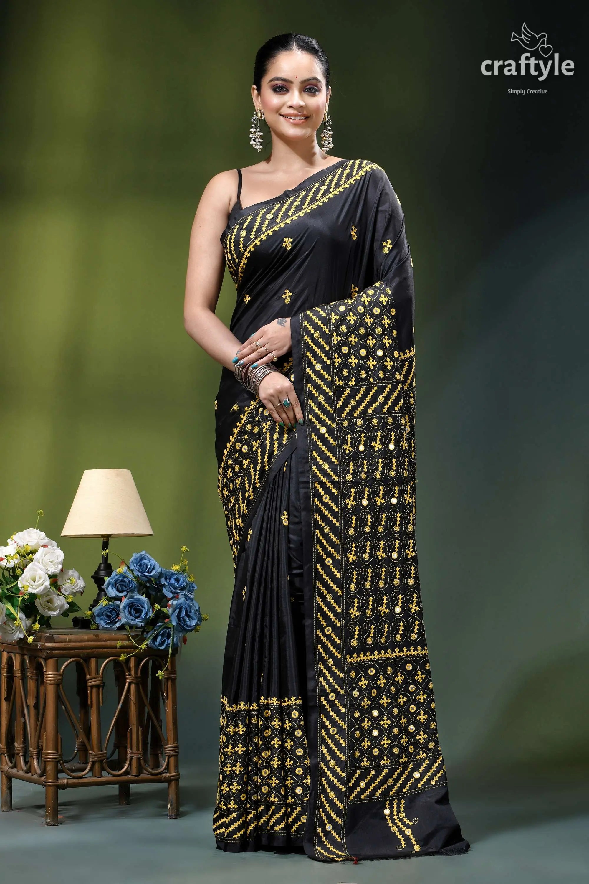 Mirror detailing black silk saree with yellow thread gujrati stitch black silk saree intricate gold 1