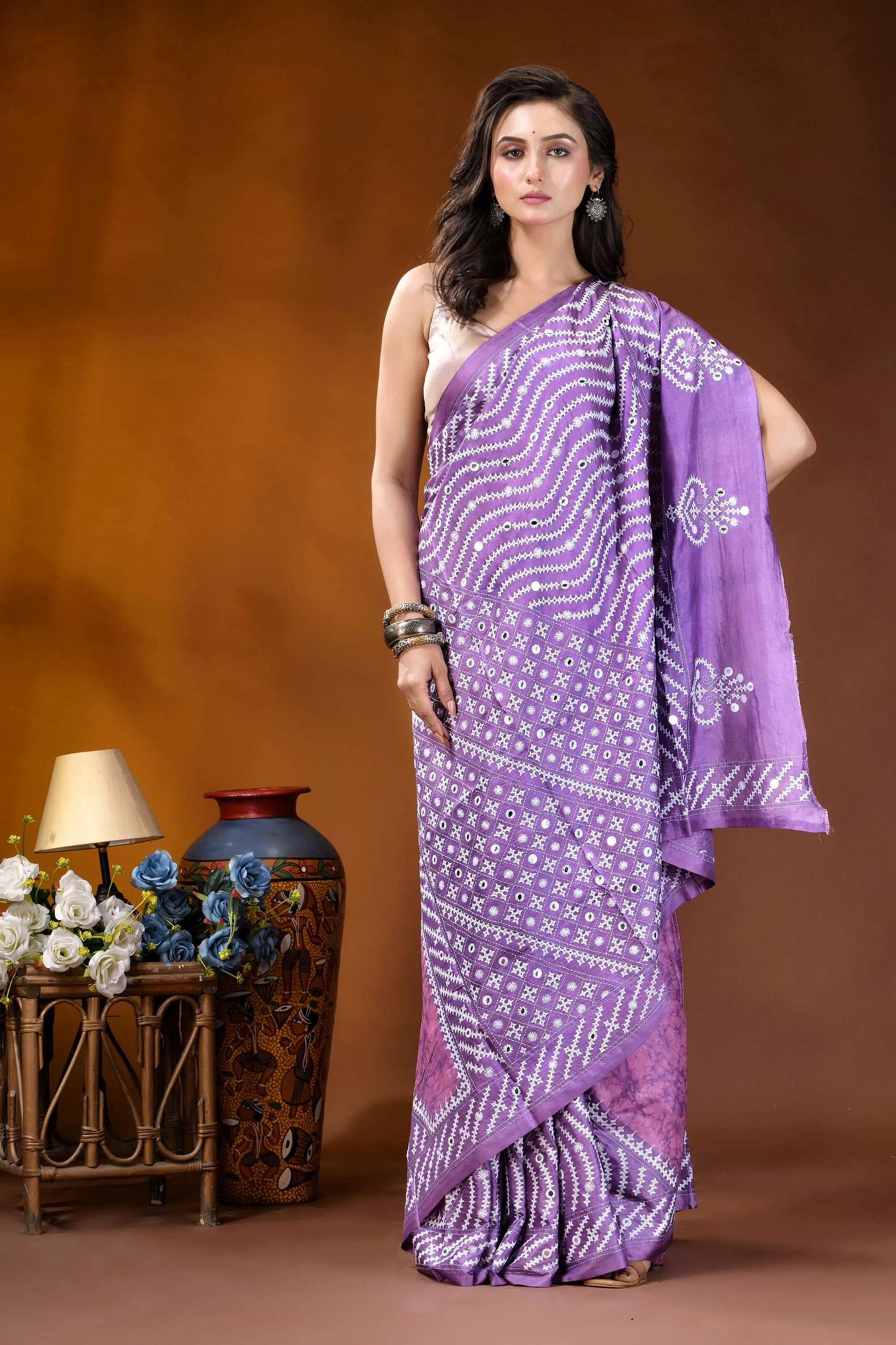Mirror work geometric pattern hand batik gujarati stitch pink lavender dyed silk saree woman wears lavender saree