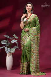 Moss green silk saree with multicolor kutch embroidery - mirror work woman wears vibrant olive 7