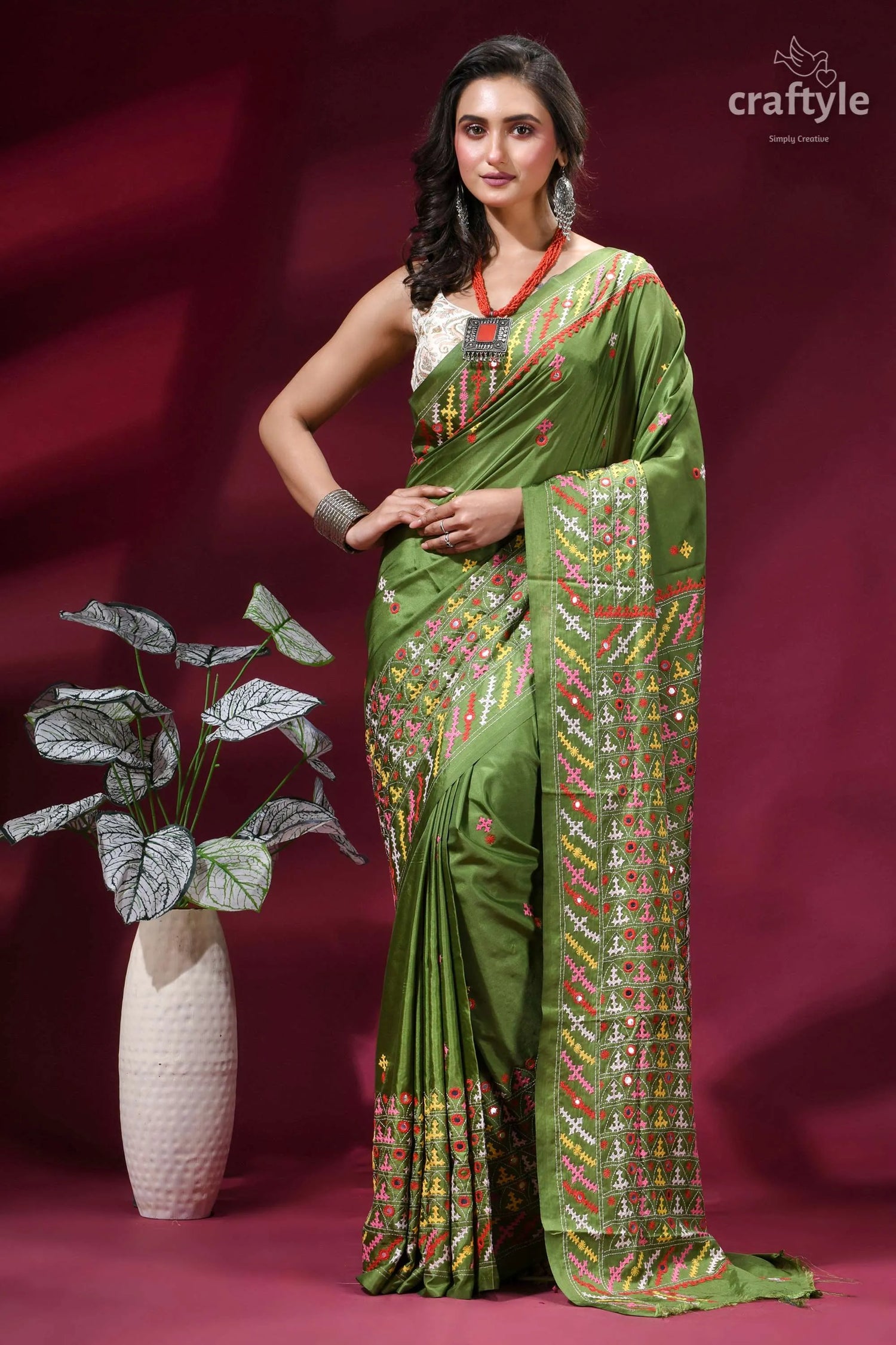 Moss green silk saree with multicolor kutch embroidery - mirror work woman wears vibrant olive 1