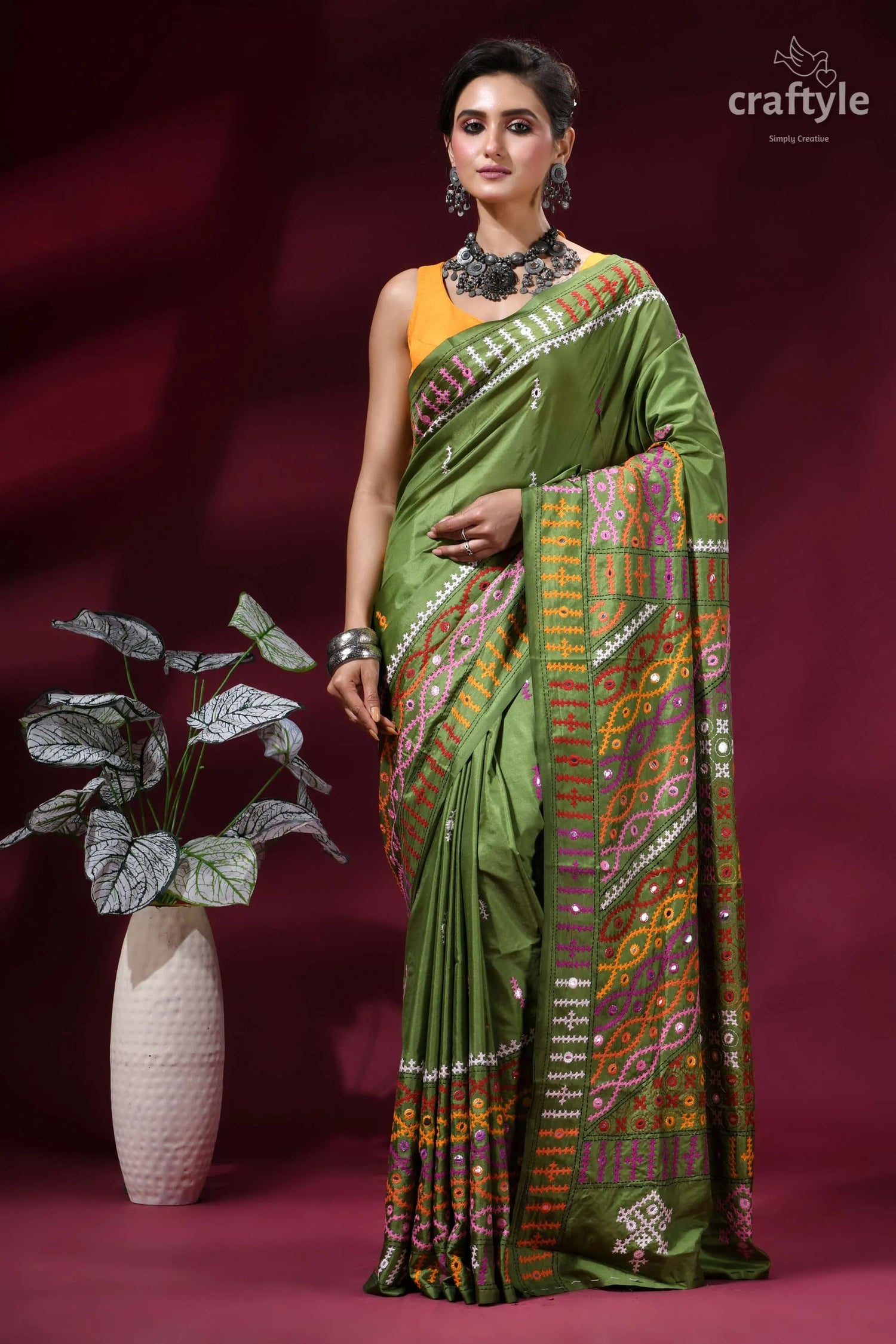 Muddy green dual-tone kutch work silk saree with mirror detailing vibrant olive green silk saree 1