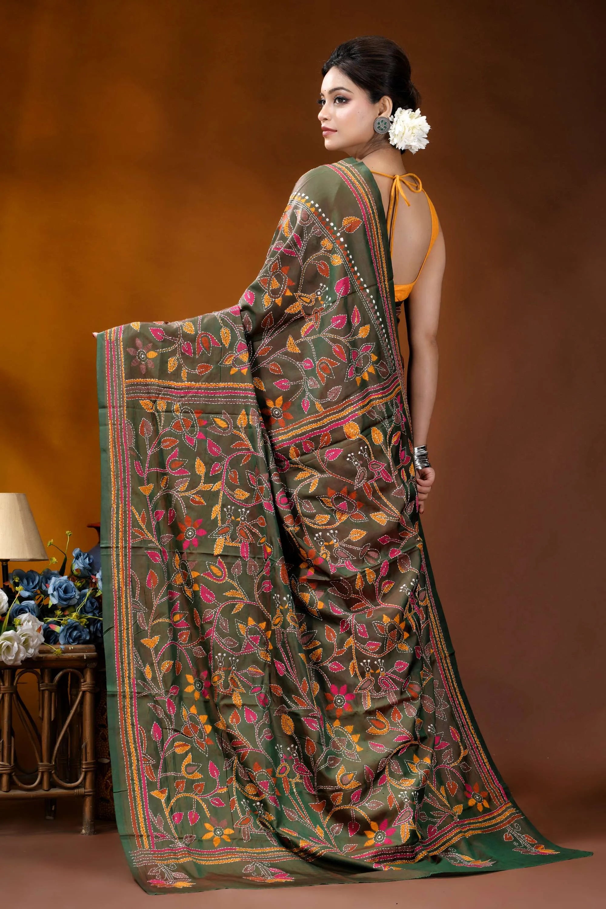 Multicolor floral design handmade jungle green silk kantha saree woman wears dark green silk 4