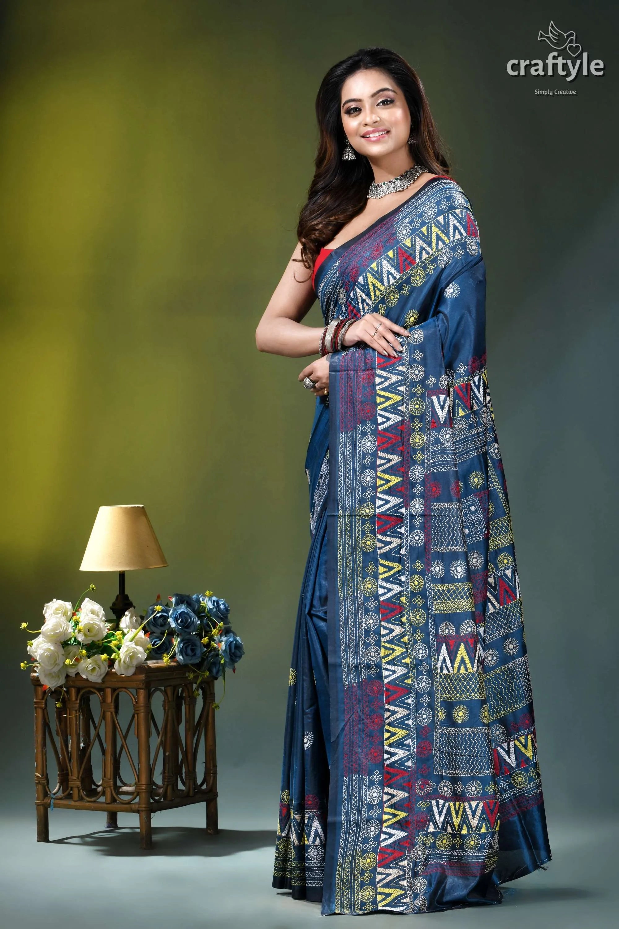 Multicolor hand embroidery silk lambani saree in dusk blue woman wears navy blue saree 3