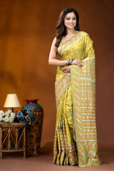 Naples yellow mirror work gujrati stitch dyed silk saree with ethnic hand batik design woman wears vibrant yellow saree