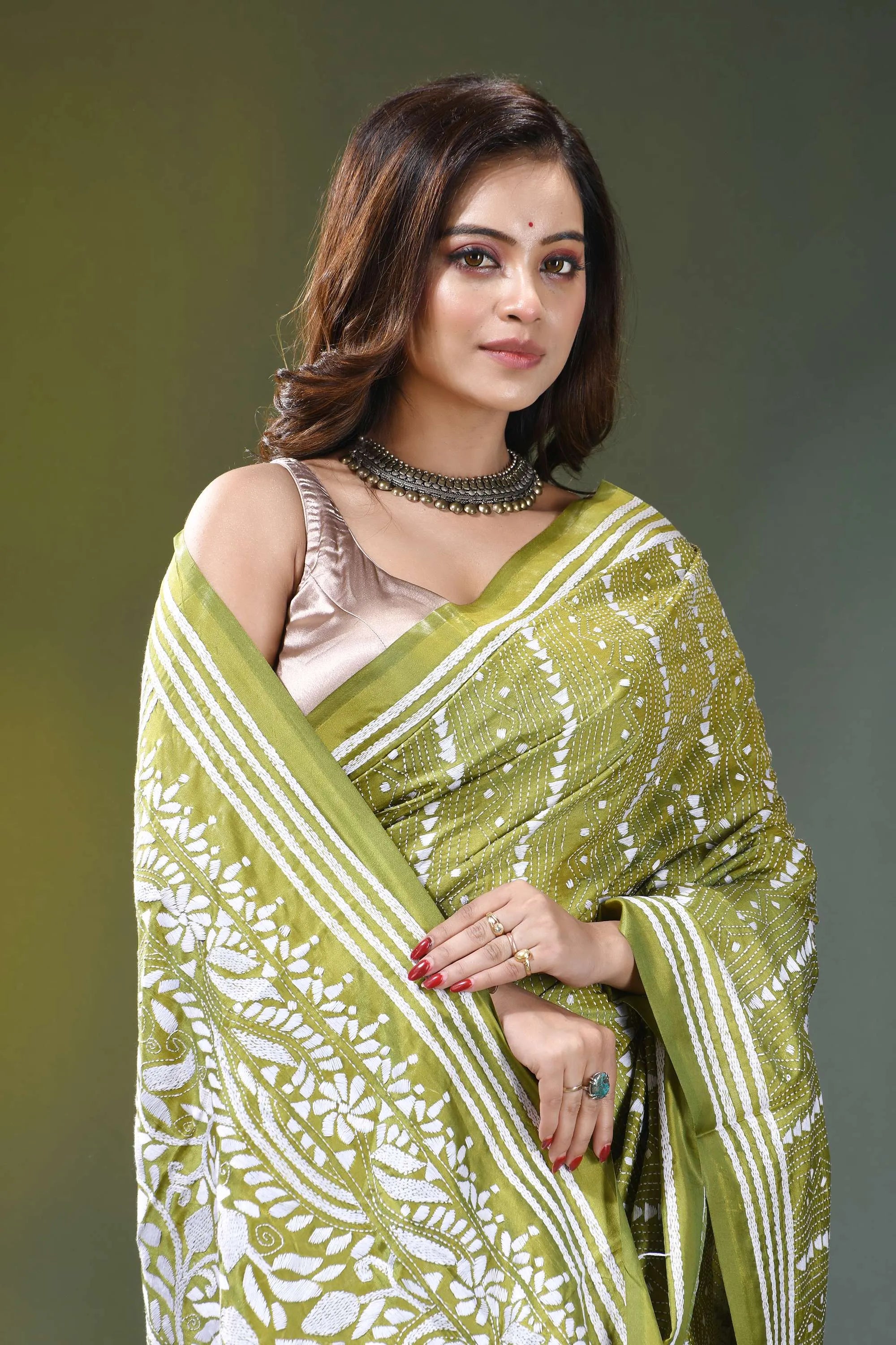 Olive green paisley floral hand embroidered silk kantha saree woman wears vibrant lime green 2