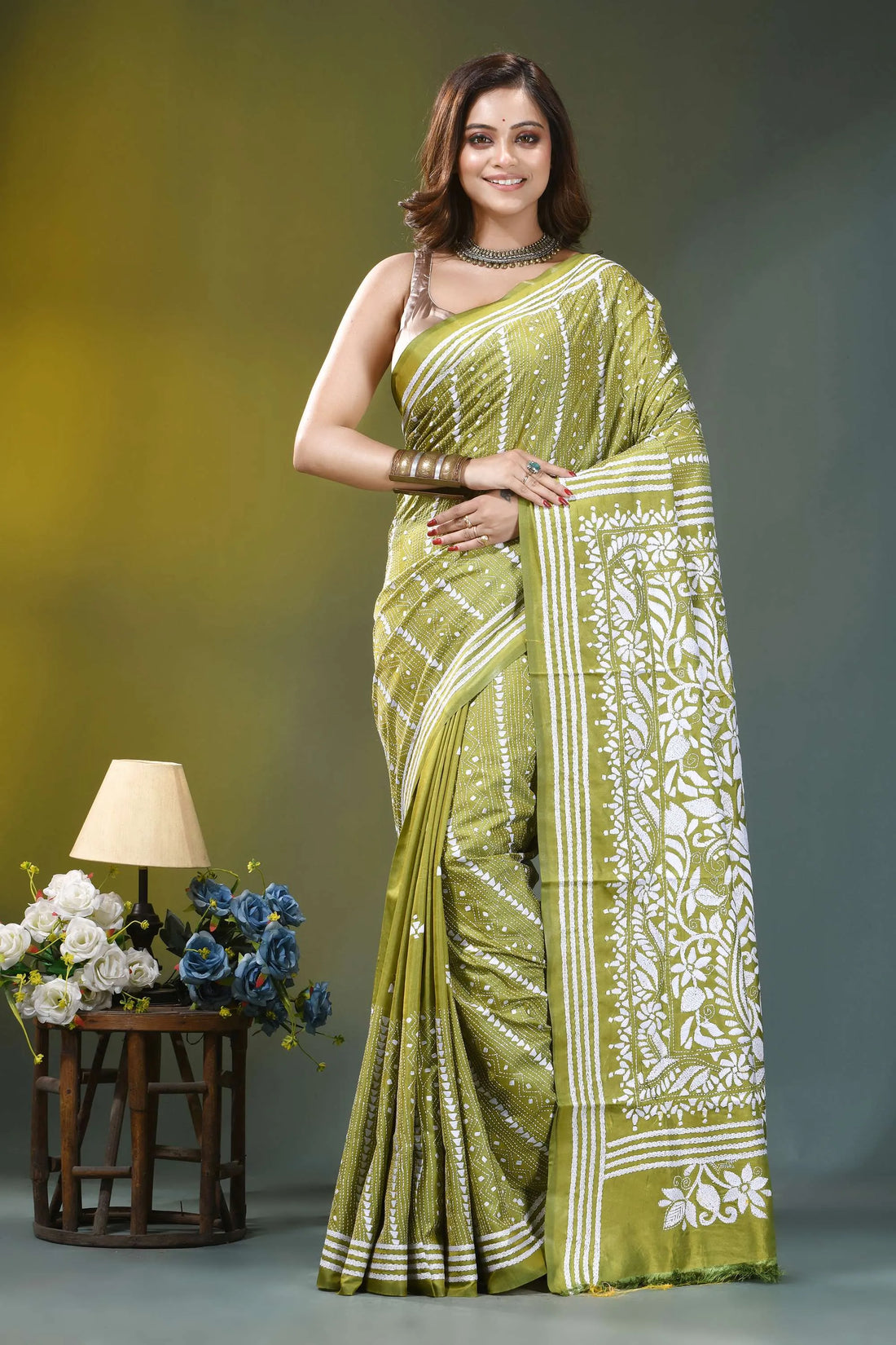 Olive green paisley floral hand embroidered silk kantha saree woman wears vibrant olive green 1