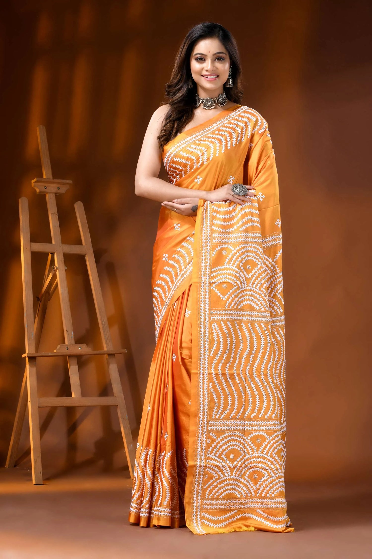 Orange silk handmade kutch work saree with geometric design 1