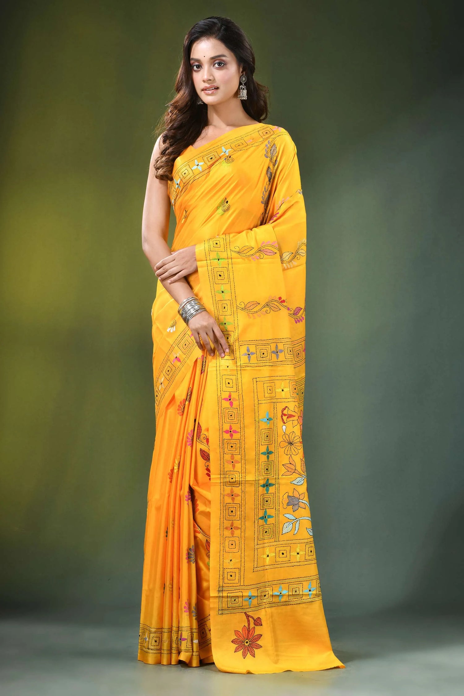Orangey yellow handcrafted floral design kantha stitch silk saree vibrant hand-embroidered intricate 1