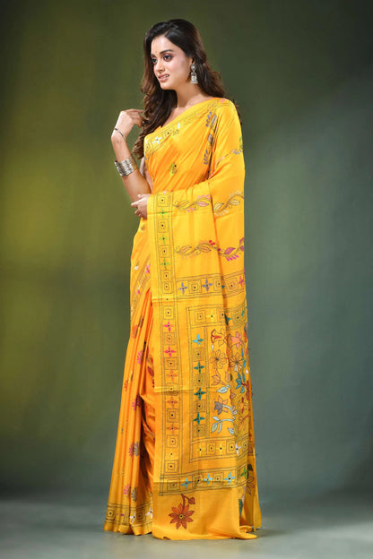 Orangey yellow handcrafted floral design kantha stitch silk saree vibrant adorned intricate 3