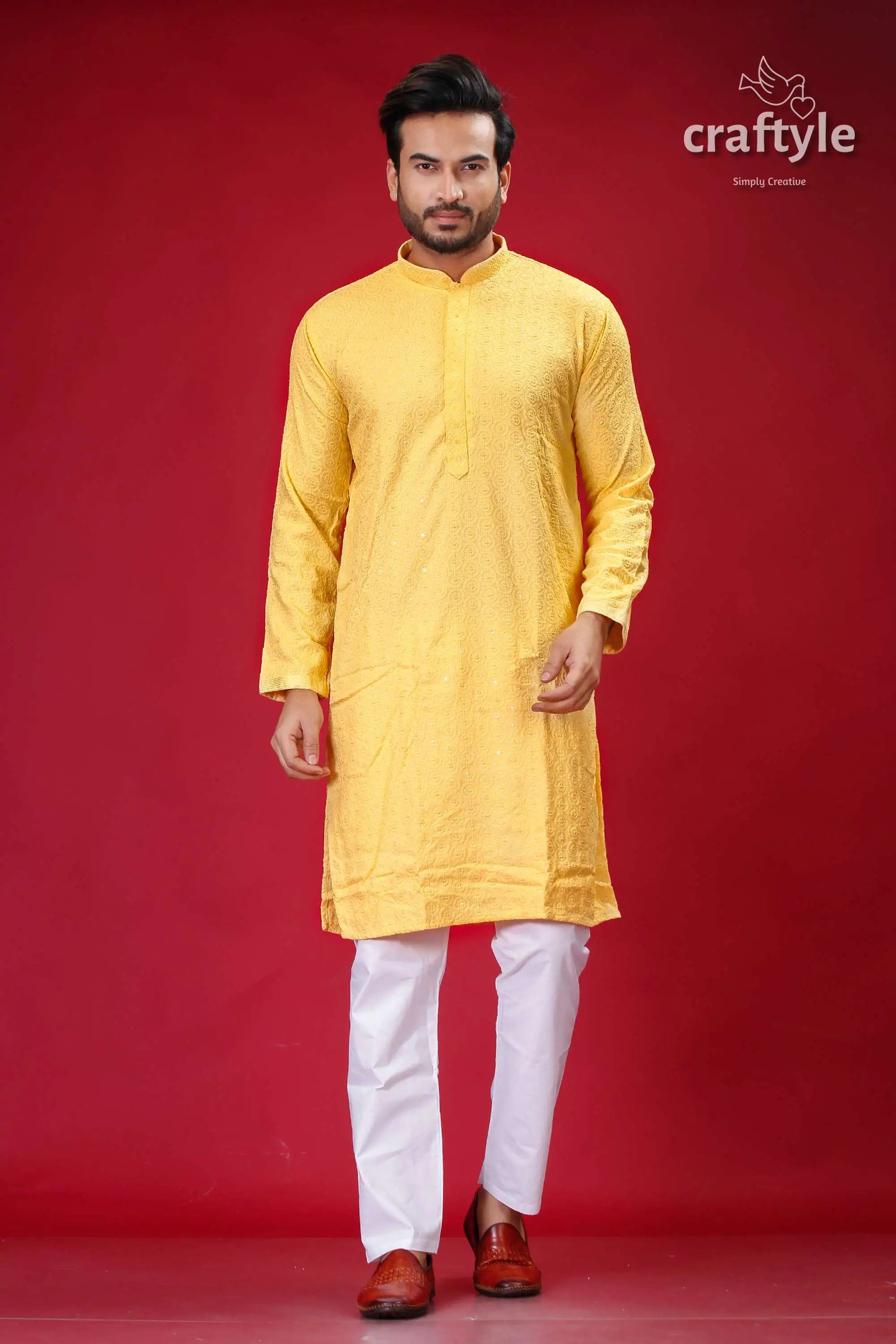 Pale yellow chikankari punjabi for men with sequin embellishments yellow kurta white pants 1