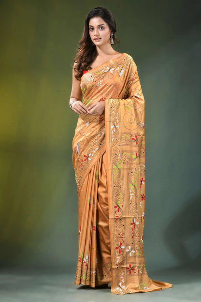 Peach hand embroidered folk art motif kantha embroidery silk saree woman wears golden-orange 1
