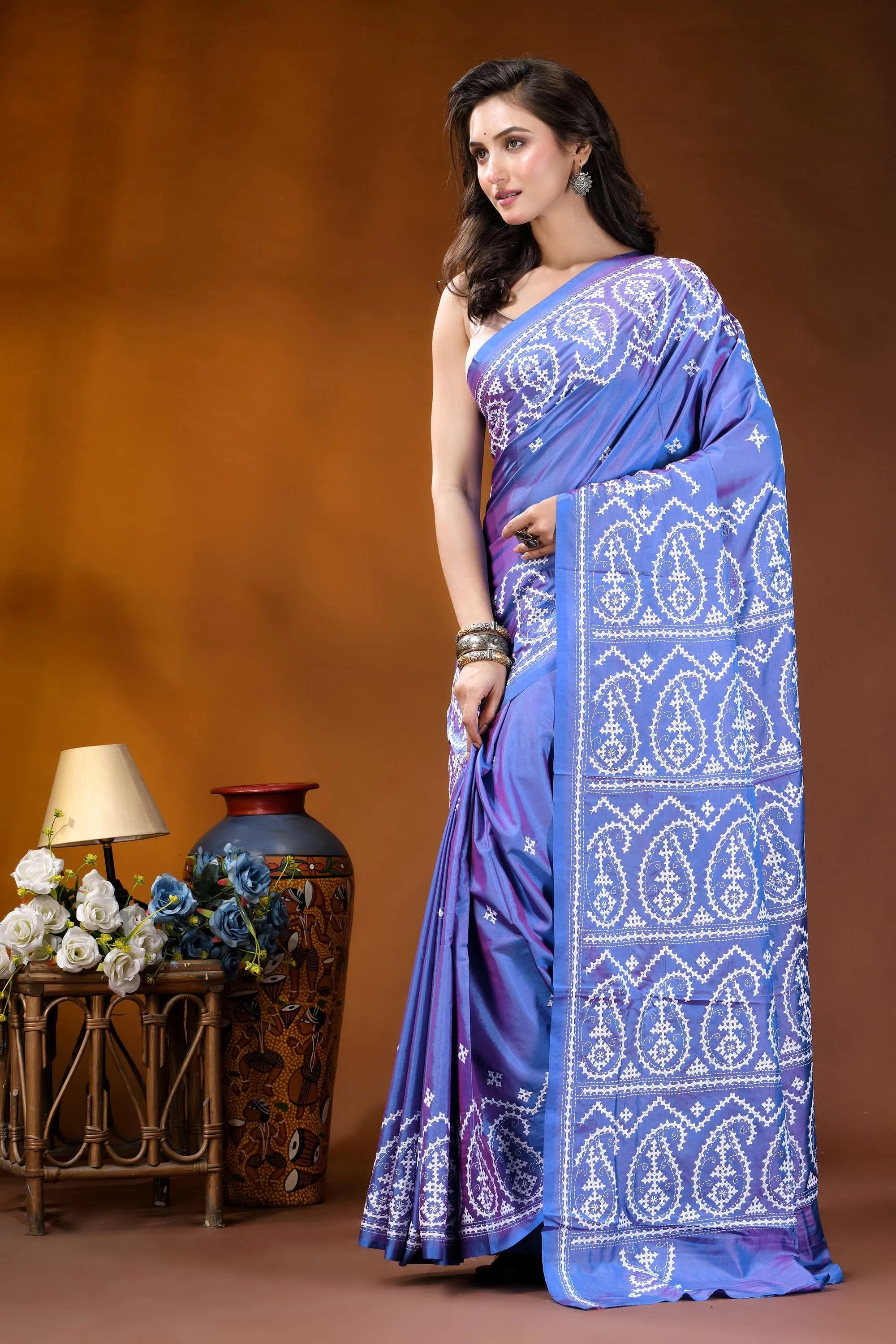 Periwinkle blue paisley motif handcrafted kutch embroidery silk saree woman wears vibrant blue saree 3