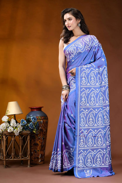 Periwinkle blue paisley motif handcrafted kutch embroidery silk saree woman wears vibrant blue saree 3