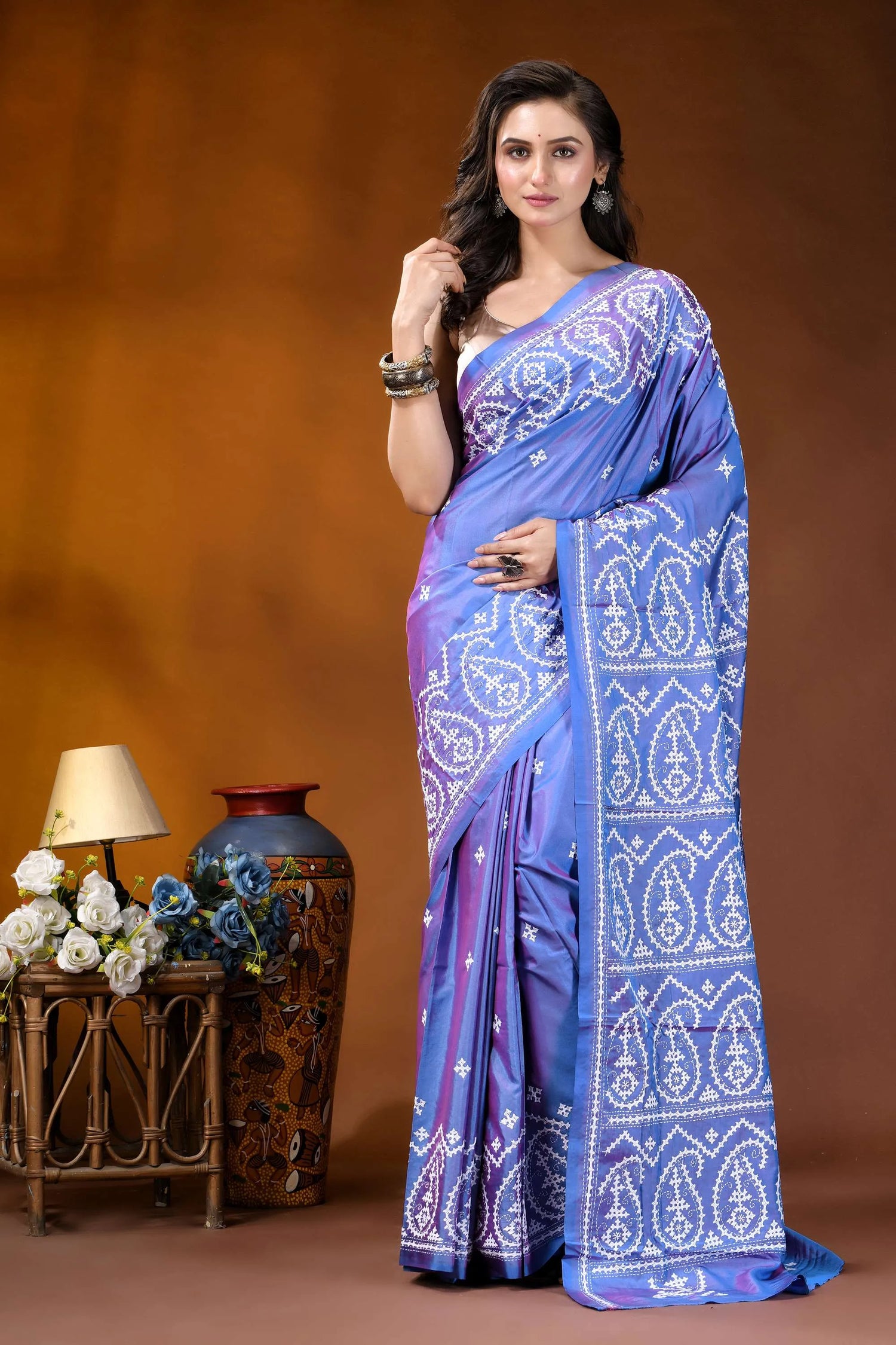 Periwinkle blue paisley motif handcrafted kutch embroidery silk saree woman wears vibrant blue purple 6