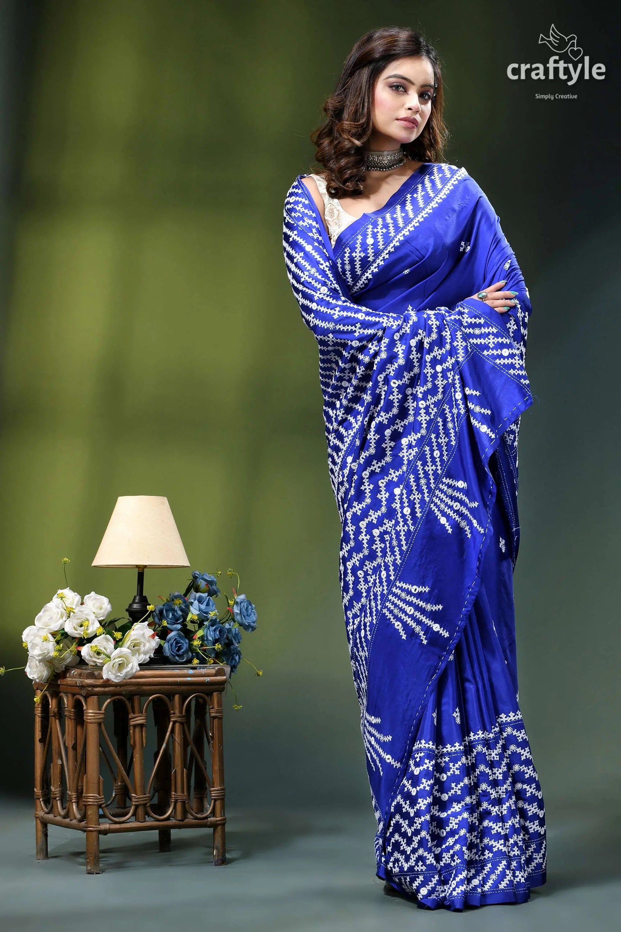 Persian blue white thread silk gujrati stitch saree with mirror work woman wears vibrant royal blue 5