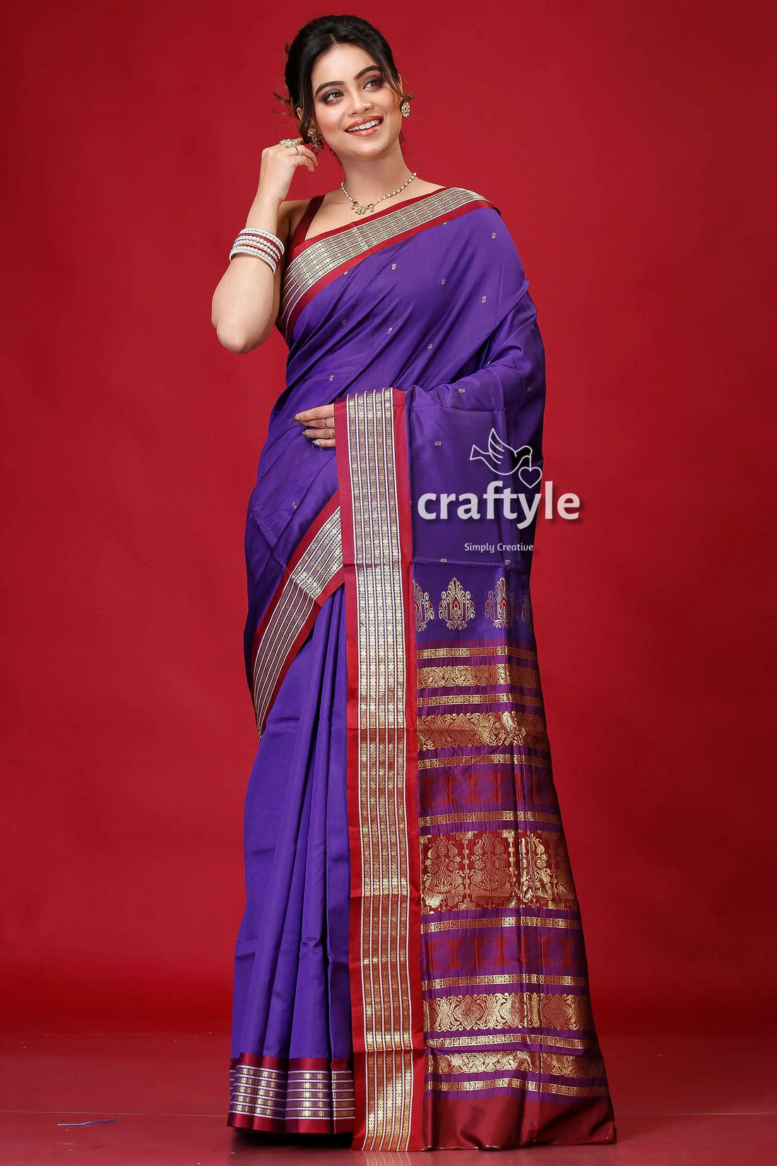 Pigment blue bomkai silk saree with woven zari border purple maroon saree gold accents 1