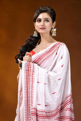 Reddish thread ethnic design handcrafted silk kantha stitch saree in white woman wears white saree intricate 2